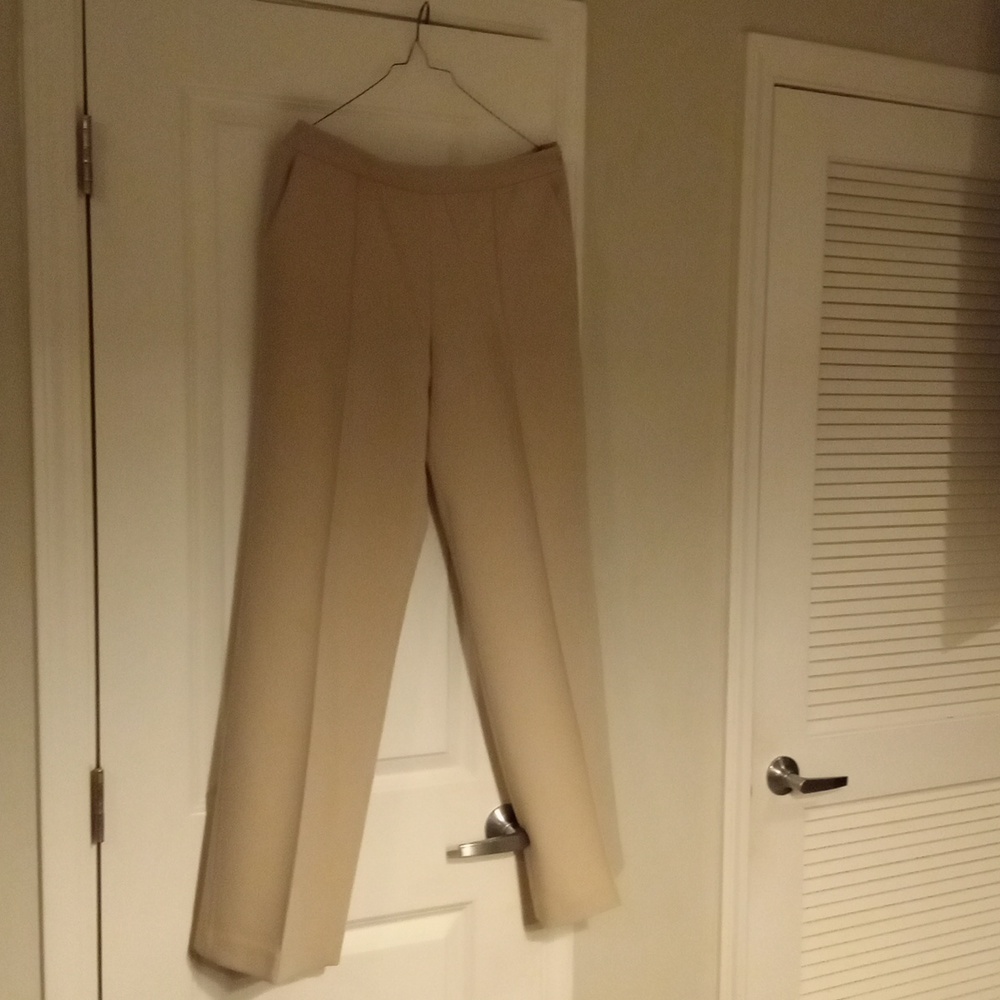 Cream colored side zipper dress pants never worn.